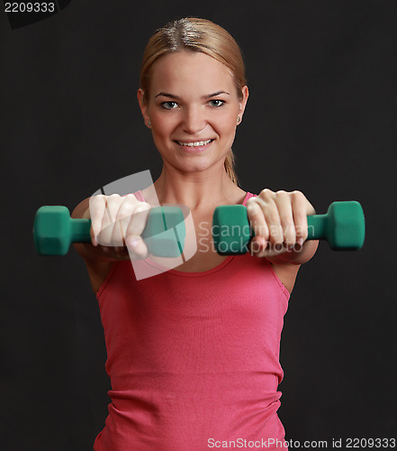 Image of Woman with Dumbbells