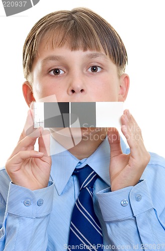 Image of Photo test shot with  color checker.   Child holding a qp card