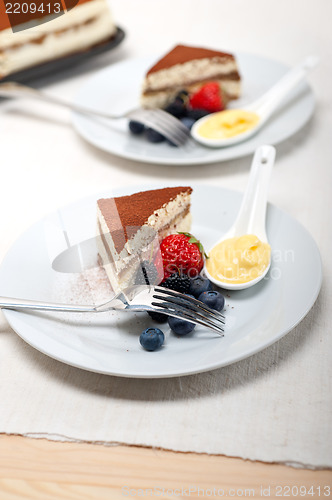 Image of tiramisu dessert with berries and cream