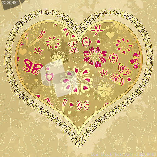 Image of Old grunge paper with gold heart