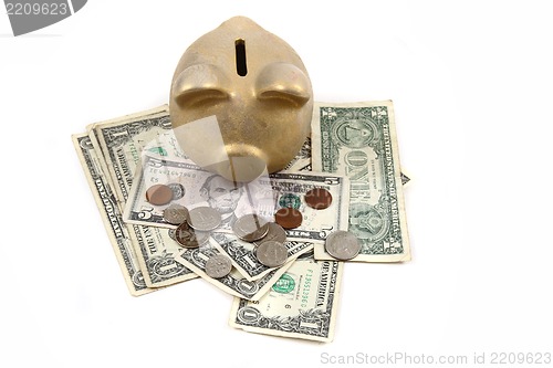 Image of gold pig bank and dollars