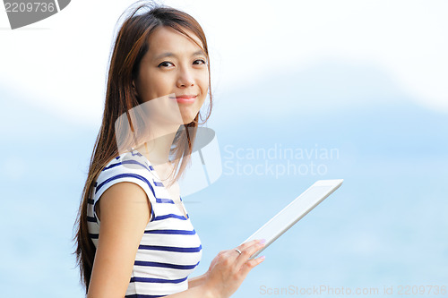 Image of young woman use tablet computer