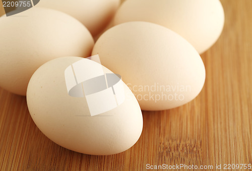 Image of Fresh egg on wood table