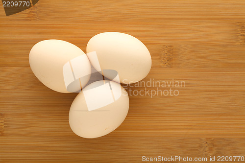Image of Fresh egg on wood table