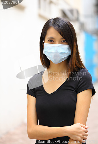 Image of Asian woman wearing face mask