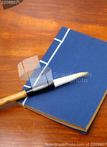 Image of chinese book and writing brush