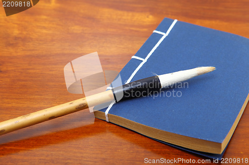 Image of chinese book and writing brush