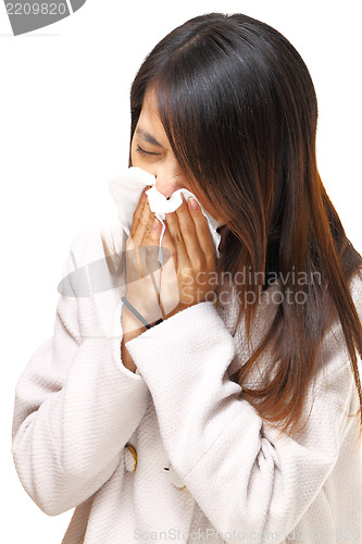 Image of woman with cold sneezing 