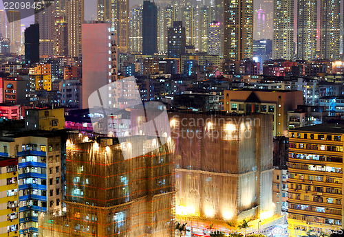 Image of apartment building at night in Hong Kong