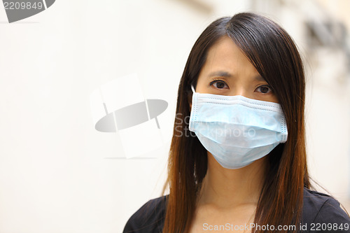 Image of Asian woman wearing face mask