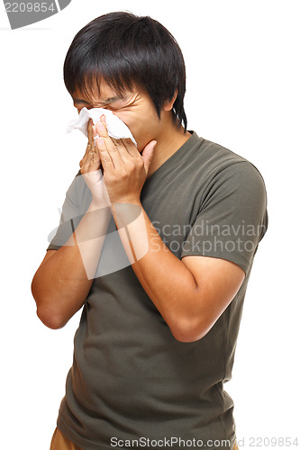 Image of man blowing nose 