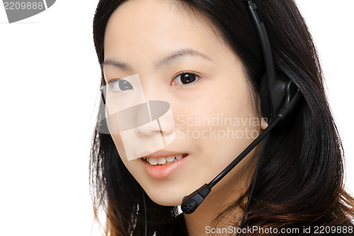 Image of asian woman assistant wearing headset