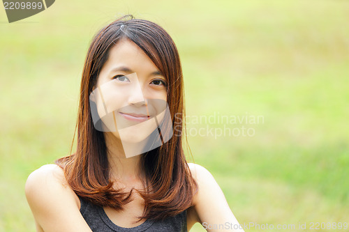Image of young woman smiling friendly