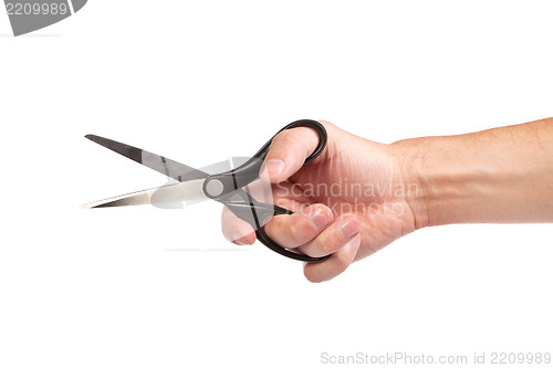 Image of Hand is holding scissors isolated