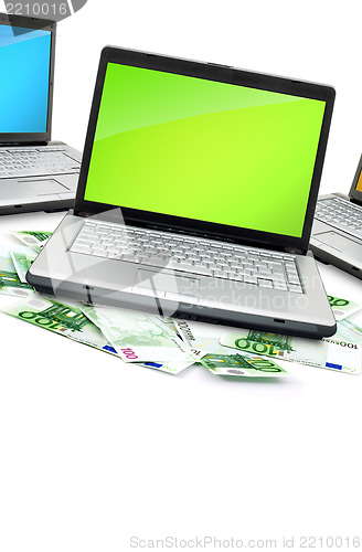 Image of Open laptop with money 