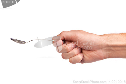 Image of Hand is holding a spoon isolated