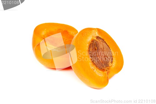 Image of Two ripe apricot sectioned by knife