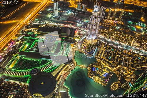 Image of Dubai downtown night scene with city lights,