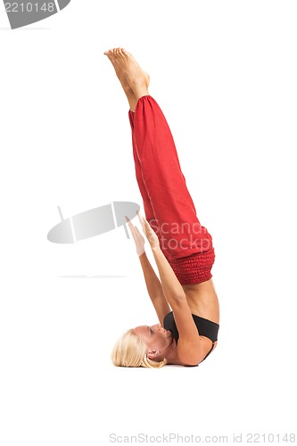 Image of Practicing Yoga. Young woman isolated on white background