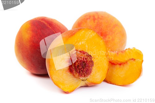 Image of Three tasty juicy peaches on a white background