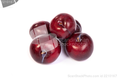 Image of Group of plums  on white