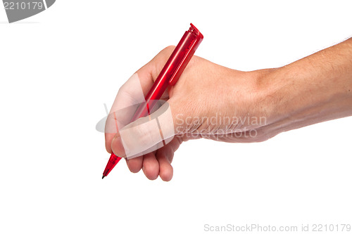 Image of Hand hold a pen writing on the white