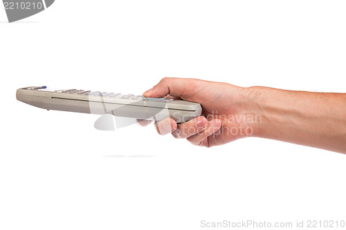 Image of A hand holding a remote control isolated