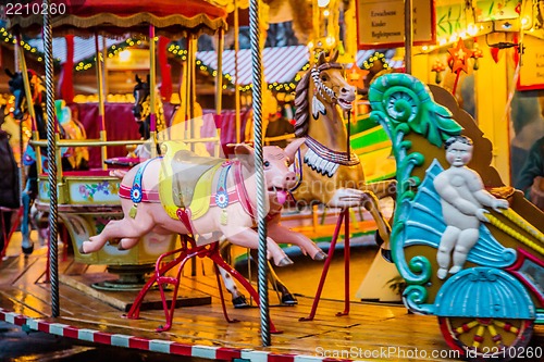 Image of Carousel. Horses on a carnival Merry Go Round.