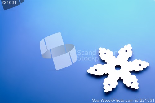 Image of snowflake over blue