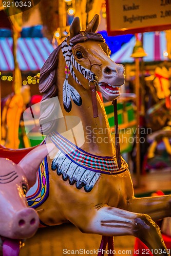 Image of Carousel. Horses on a carnival Merry Go Round.