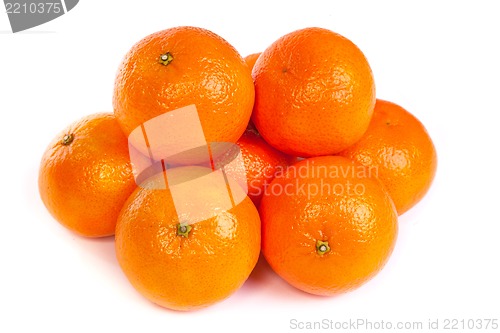 Image of Group of ripe tangerine or mandarin with slices on white