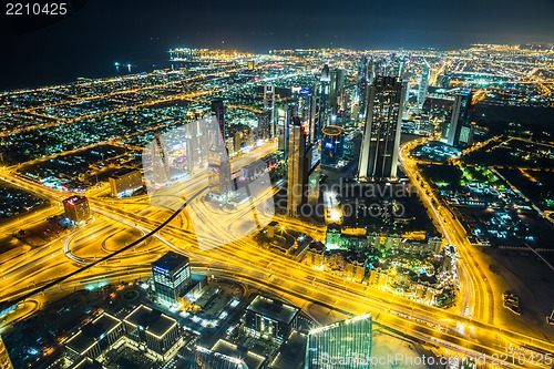 Image of Dubai downtown night scene with city lights,