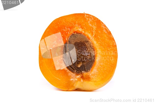 Image of Two ripe apricot sectioned by knife