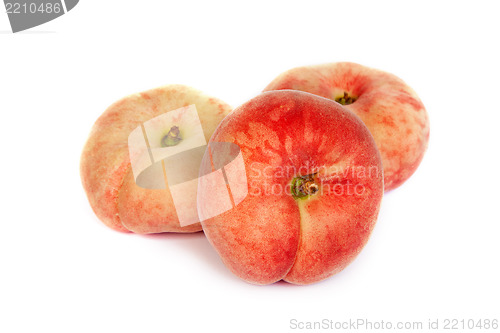 Image of Three ripe fig peach on white