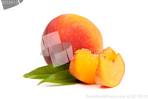 Image of One tasty juicy peache wtih slices  on a white background