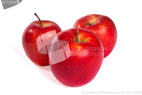 Image of Three shiny red apples isolated on white