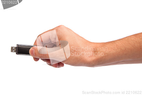 Image of Closeup image: hand holding black USB data storage or connecting