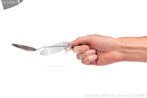 Image of Hand is holding a spoon isolated