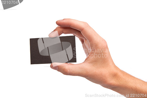 Image of Businessman's hand holding blank business card