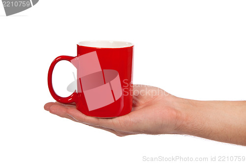 Image of Male hand is holding a red cup