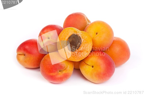 Image of Group of ripe apricots with a half