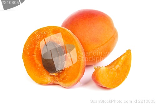 Image of Two ripe apricot sectioned by knife