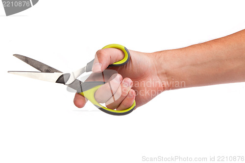 Image of Hand is holding scissors isolated