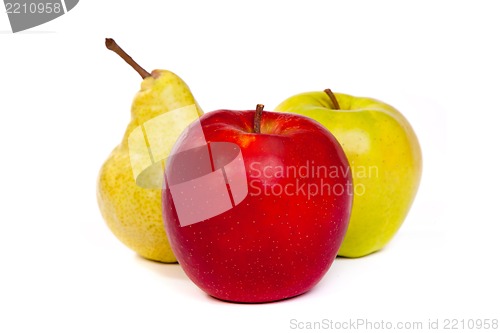 Image of A pear and a red apple and a green apple isolated on white