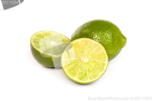 Image of One whole lime and one half lime on white
