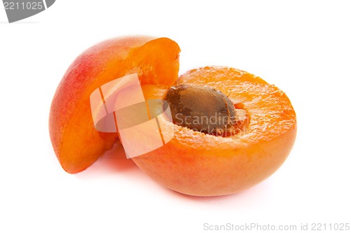 Image of Two ripe apricot sectioned by knife