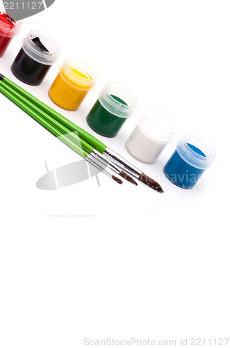 Image of Paints with paintbrushes