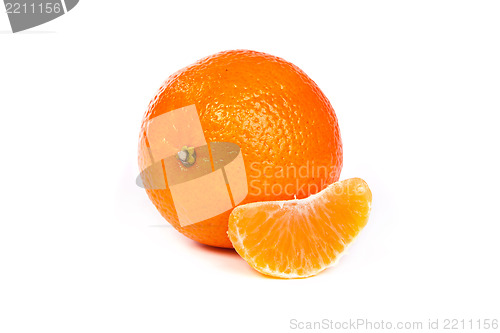 Image of Ripe tangerine or mandarin with slices on white