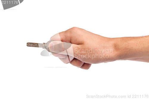 Image of Male hand holding a key to the house