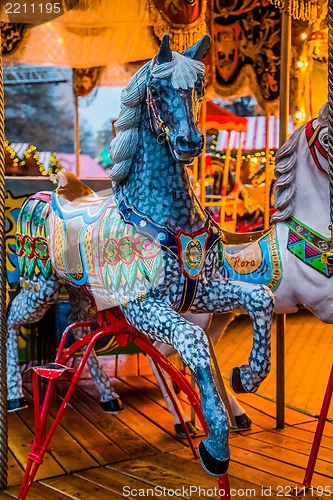 Image of Carousel. Horses on a carnival Merry Go Round.